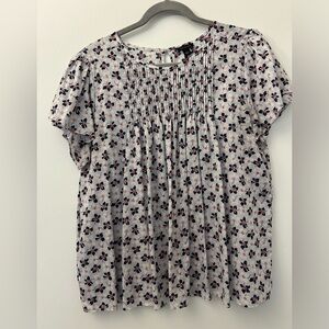 Ann Taylor pintucked flutter sleeve top with blue and red floral design